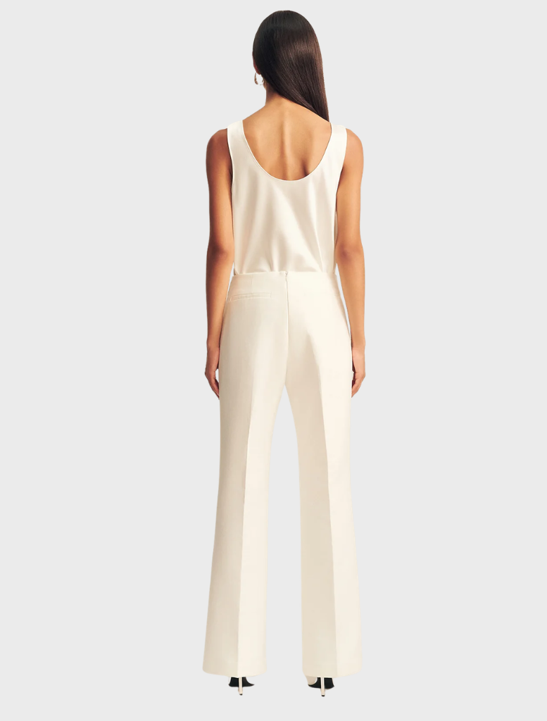 Ivory Otis Pant on a model, illustrating its fit and style in a casual setting.