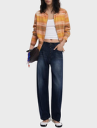 Women's hoodie in orange with a distinctive striped pattern, suitable for casual outings.