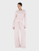 Soft blush Jada Cashmere Pant shown, highlighting its luxurious fabric and chic design for both casual and formal occasions.