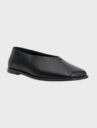 Elegant black jade ballet flats featuring a minimalist style suitable for various occasions.