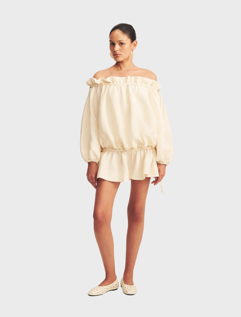 A mini dress in a linen blend, featuring a resin finish, showcasing a stylish and casual design.