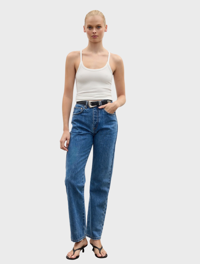  White Jayla tank top displayed on a hanger, featuring a simple design and lightweight fabric suitable for warm weather.