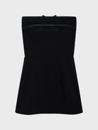 Black strapless mini dress featuring a fitted silhouette and a chic, modern design suitable for various occasions.