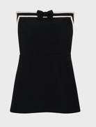  Sophisticated black strapless mini dress showcasing a contemporary style, perfect for evening wear.