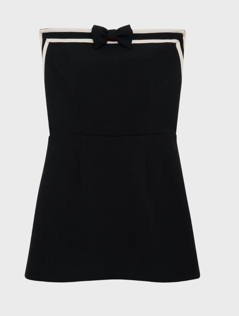  Sophisticated black strapless mini dress showcasing a contemporary style, perfect for evening wear.