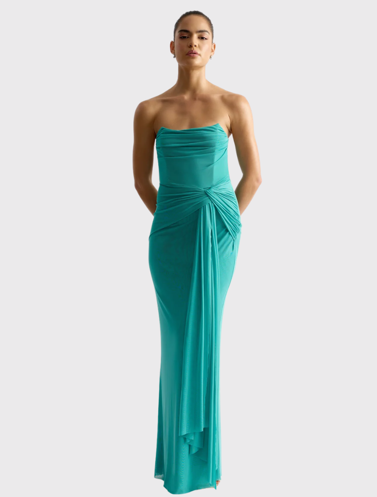 Strapless, floor-length jade gown made of three layers of soft stretch mesh, featuring a scooped neckline and gathered waist sash.