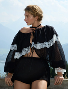 Black June top showcased, featuring a minimalist design that complements a range of outfits and styles.