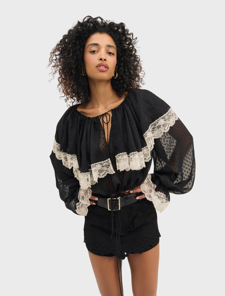 Black June top on display, highlighting its sleek design perfect for both everyday and special events.
