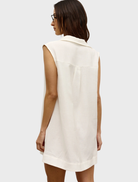Back view of a woman in a white shirt dress, showcasing the Juno Dress design.