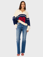 Fitted low-rise jeans that hug the hips and thighs, flaring into a bootcut leg for a stylish, elongating look.
