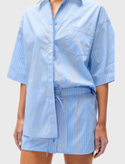 Blue striped Kanzo Shirt with a white pointed collar, button front, and short sleeves, designed for a relaxed silhouette.