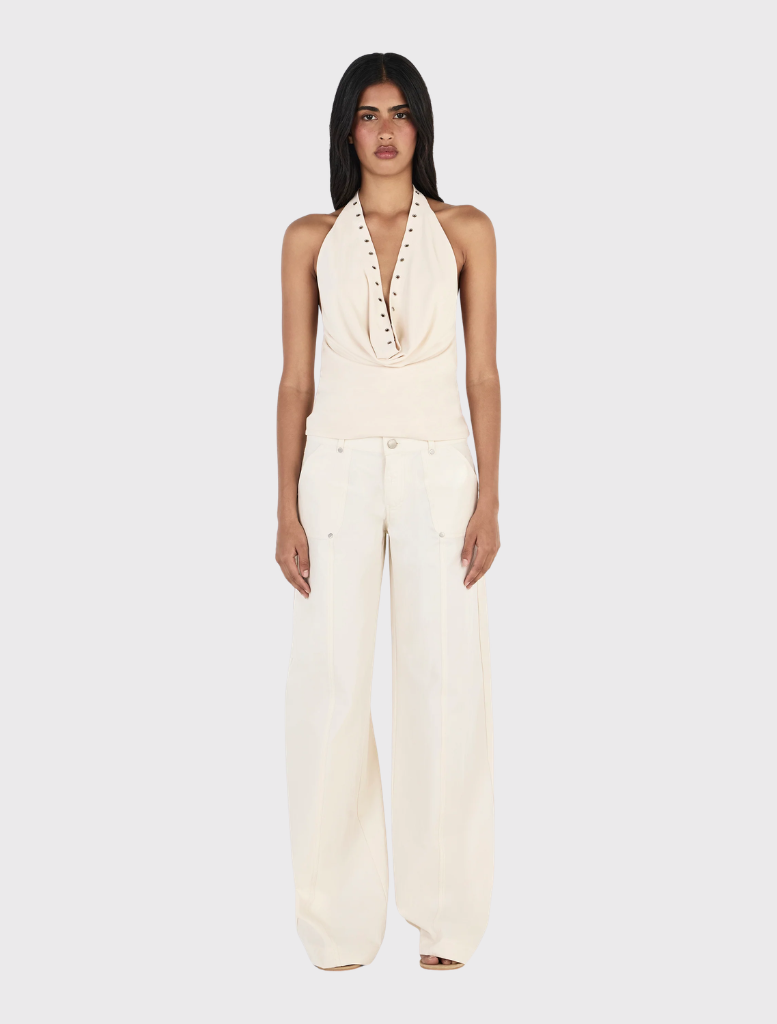 Cream Kehlani Pant features a relaxed straight leg, low-rise fit, zip fly, belt loops, and functional pockets for everyday wear.