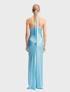 La Lune's iceberg blue ruched halter maxi dress, featuring a stylish design and a flattering silhouette for any occasion.