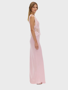 Beautiful rose-colored lace dress reaching the floor, showcasing a sophisticated style for formal celebrations.