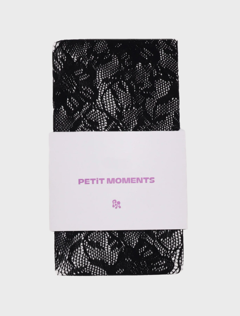A package of black lace tights featuring a white label on the front.