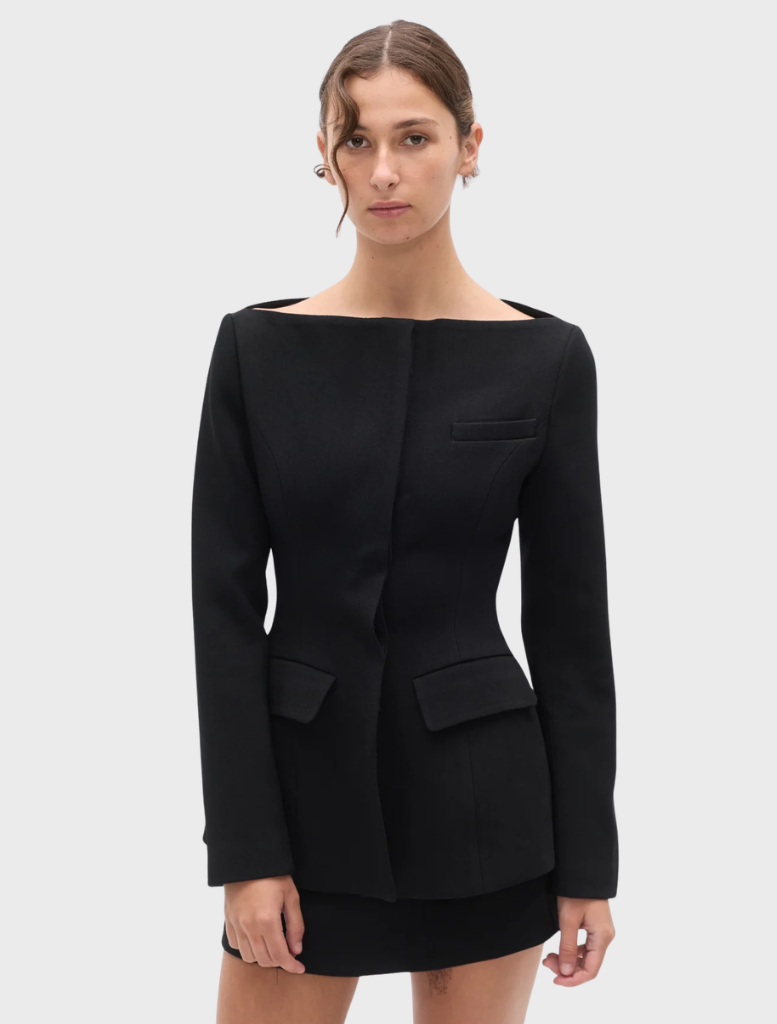 Black Laurent blazer presented on a hanger, highlighting its sophisticated design and professional appearance.