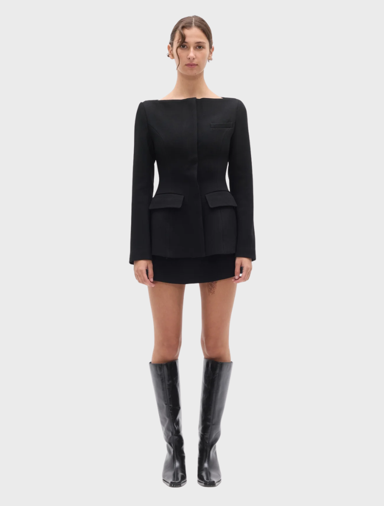Black Laurent blazer displayed on a hanger, showcasing its tailored design and sleek silhouette.