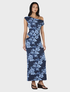 Navy maxi dress adorned with a rolling waves design, offering a chic and graceful appearance.
