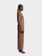 Leda Maxi Skirt in a warm oak hue, offering a stylish and versatile addition to any wardrobe.