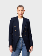 Navy Legacy Blazer displayed on a hanger, featuring a tailored fit and classic lapel design.