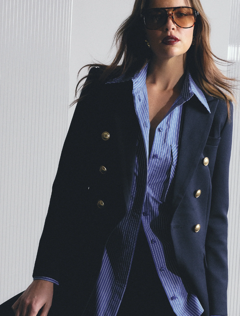 Front view of a navy Legacy Blazer, showcasing its structured silhouette and elegant lapels.