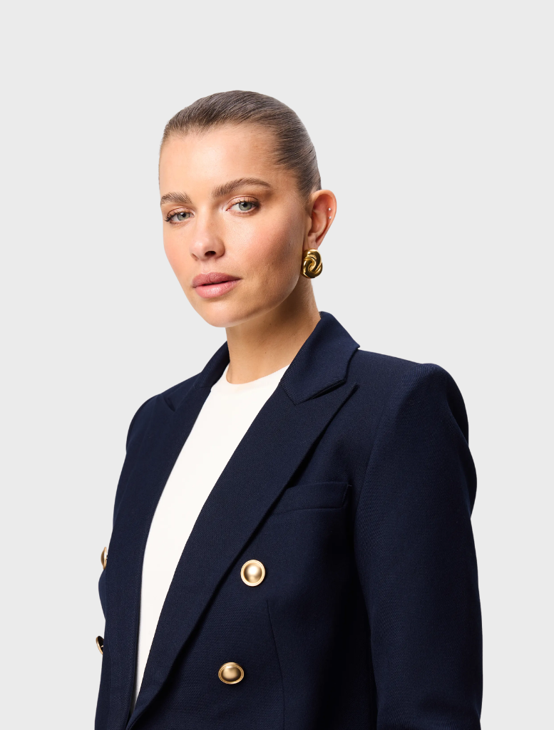 Navy Legacy Blazer presented on a hanger, illustrating its classic style and professional look.