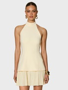 A cute, miniature lemon, featuring a sunny yellow hue and a polished texture, perfect for decorative purposes.