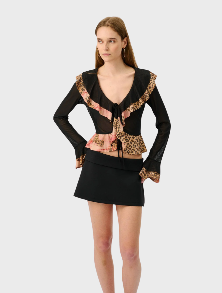Stylish frill cardigan in a mesh fabric adorned with a bold leopard print, perfect for adding flair to any outfit.