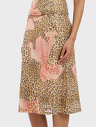 Chic midi skirt in a mesh material, adorned with a striking leopard print, ideal for casual or dressy occasions.