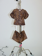 Soft, stretchy leopard print shorts, named Penelope Bow Hot Short, perfect for casual wear.