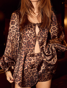 Fashionable leopard print shorts with a bow, offering a bold and trendy addition to any wardrobe.