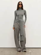 A light grey marle Isley top hanging, featuring a simple and elegant style suitable for everyday wear.