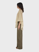  Pistachio-colored Simona Poncho, showcasing a modern and elegant style for versatile wear.