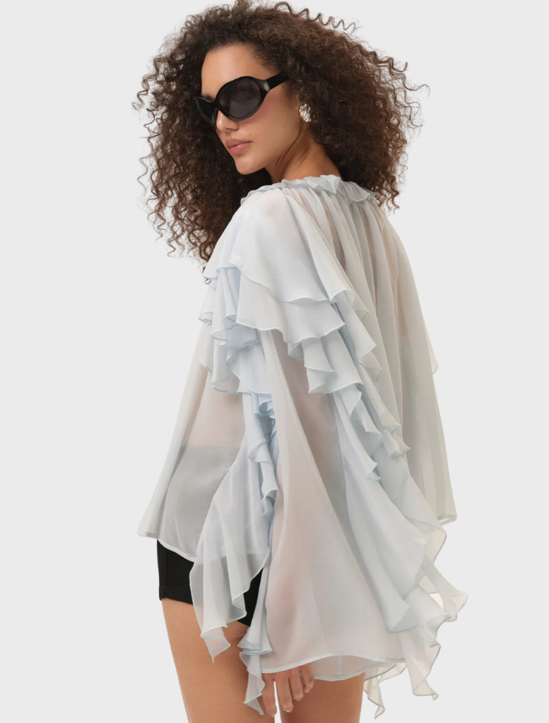 Blue Lila Bow Blouse with a chic bow accent at the collar, designed for a comfortable and elegant fit.