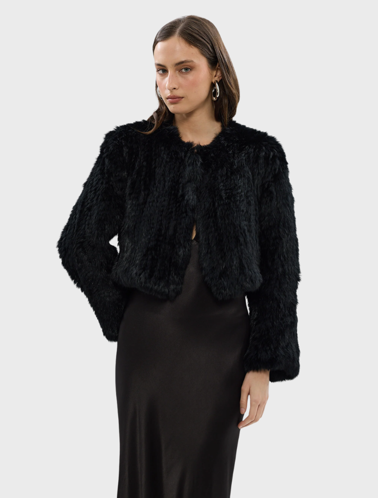 Black Lola Crop Jacket featuring a stylish design, perfect for layering in casual or formal outfits.