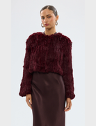 Wine-colored Lola crop jacket with a stylish design, perfect for layering in cooler weather.