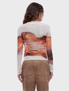 Autumn leaf print long sleeve top, showcasing a stylish design suitable for cooler weather.