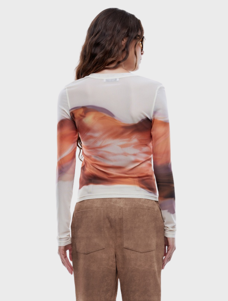Autumn leaf print long sleeve top, showcasing a stylish design suitable for cooler weather.