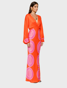 Flowing orange long sleeve maxi dress, combining elegance and comfort for a fashionable statement.