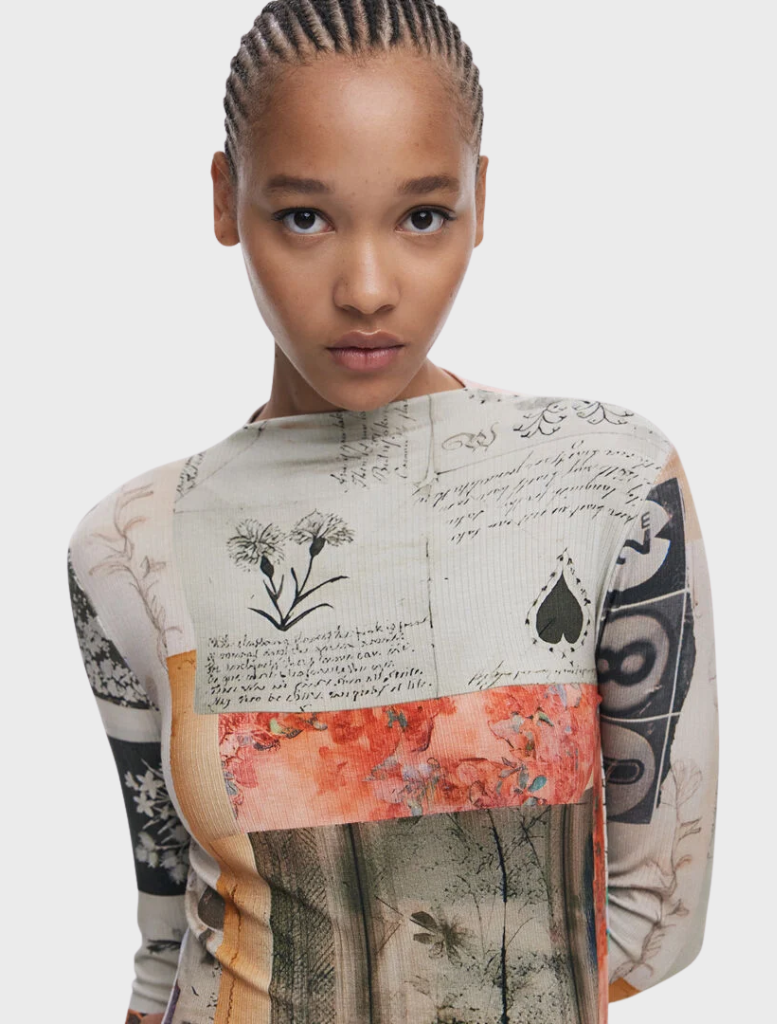 Fashionable long-sleeved dress featuring an artistic print, combining various colors for a striking look.