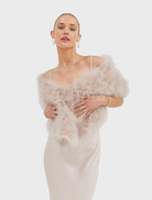 Elegant blush Lottie Wrap crafted from upcycled Marabou Feather, with lightweight design and hand-knit finish.