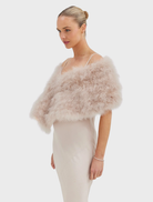 Elegant blush Lottie Wrap crafted from upcycled Marabou Feather, with a lightweight design and hand-knit finish.