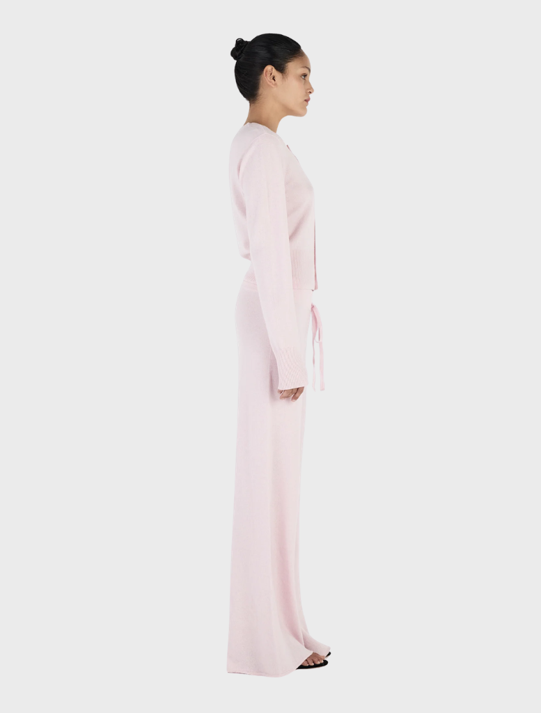 Blush Lucielle Cashmere Cardigan laid flat, illustrating its smooth texture and sophisticated look for casual wear.