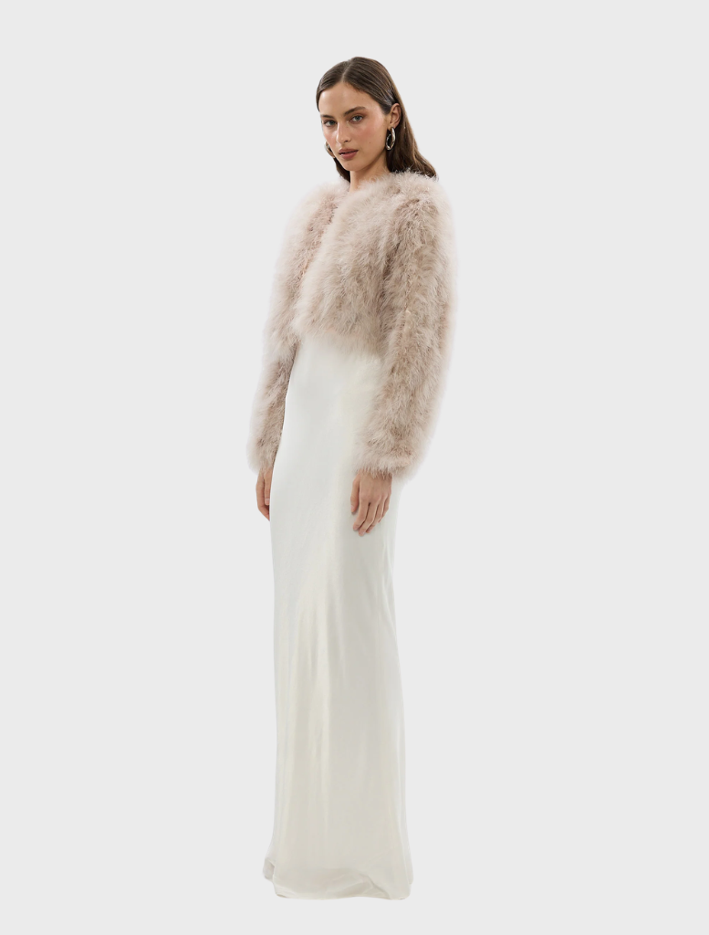 Stylish blush Manhattan crop jacket on display, emphasizing its trendy design and flattering silhouette.