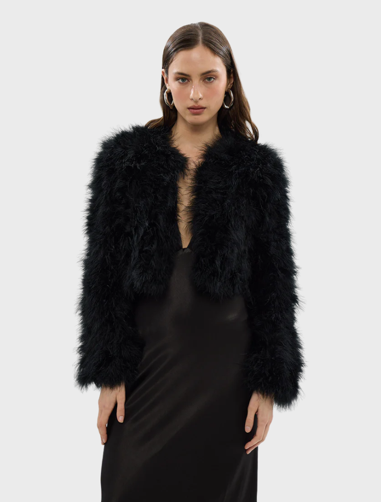  Black Manhattan crop jacket featuring a modern design and tailored fit, perfect for stylish layering.