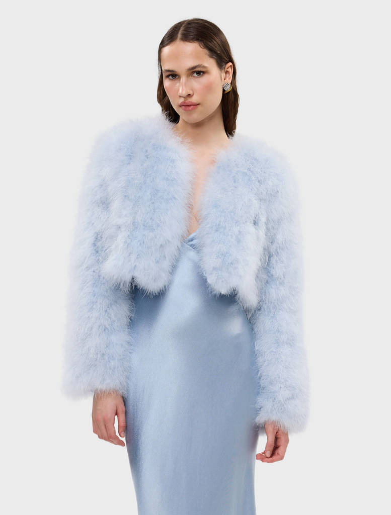 Powder blue Manhattan Crop Jacket made of marabou feathers, featuring structured shoulders and a feminine cropped design.