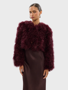 Wine-colored Manhattan crop jacket with a stylish design, perfect for layering in cooler weather.