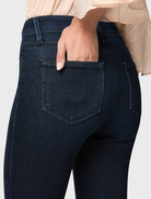The Forum's high-rise bootcut jeans, offering a flattering fit and trendy design for fashionable city living.