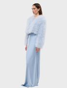 Elegant Manhattan Crop Jacket in powder blue, crafted from marabou feathers with a cropped silhouette and satin lining.