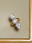A stunning diamond ring with three stones in gold and white gold, known as the Marais Triple Statement Ring.